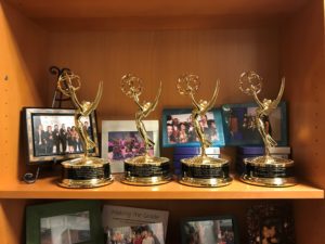 A photo of Emmy statues on a shelf at the Seattle Channel studios.