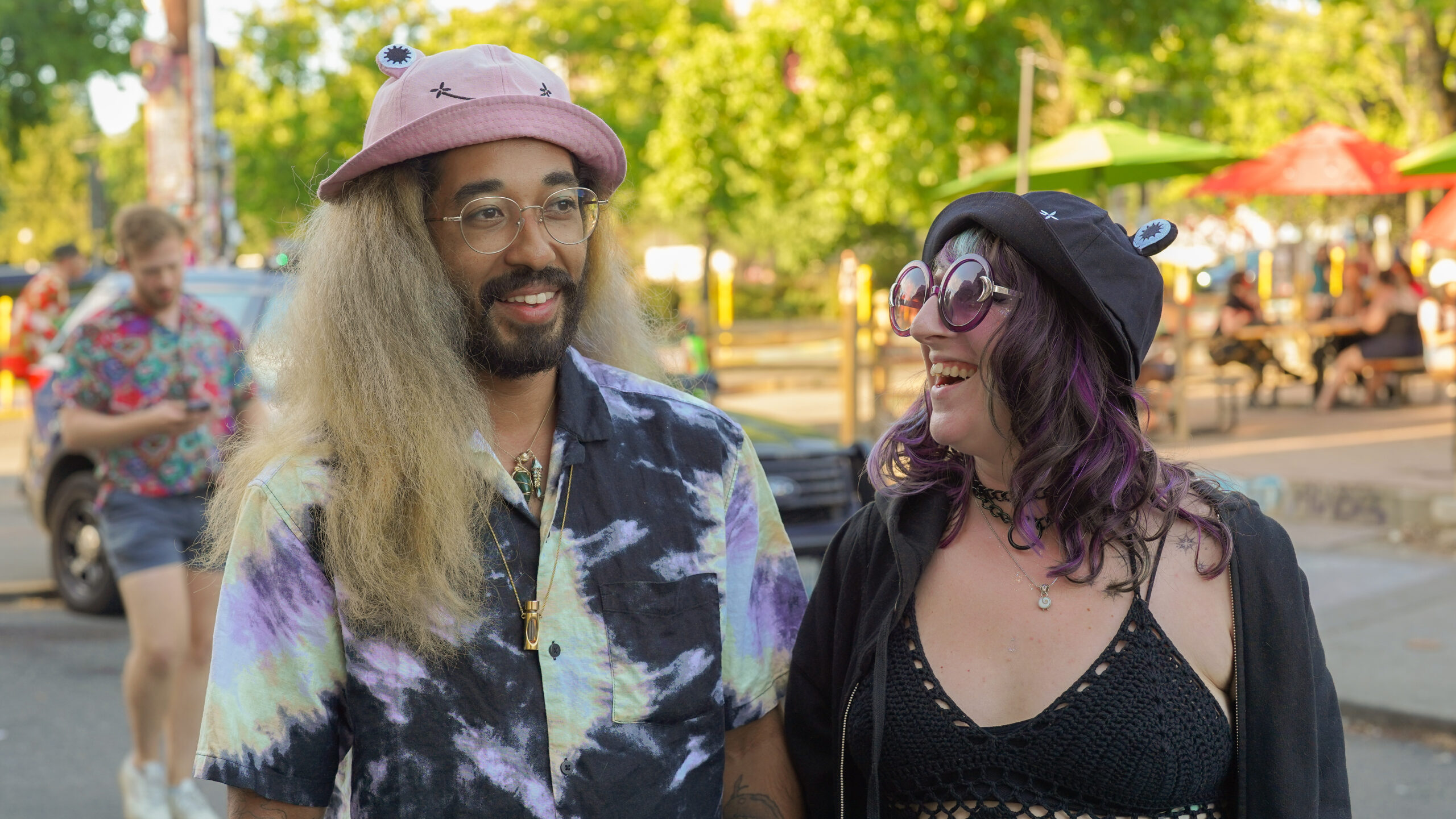 Couple Lamont Allen, left, and Beka Carr are rocking matching froggy hats complimented by
alternative summer ensembles inspired by punk.
