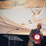 Videographer Randy Eng holds his plaque from the Silver Circle Awards. Photo: Vivian Hsu